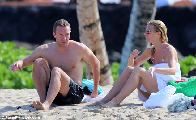 Chris and Gwyneth visit Hawaii on New Year's Eve.